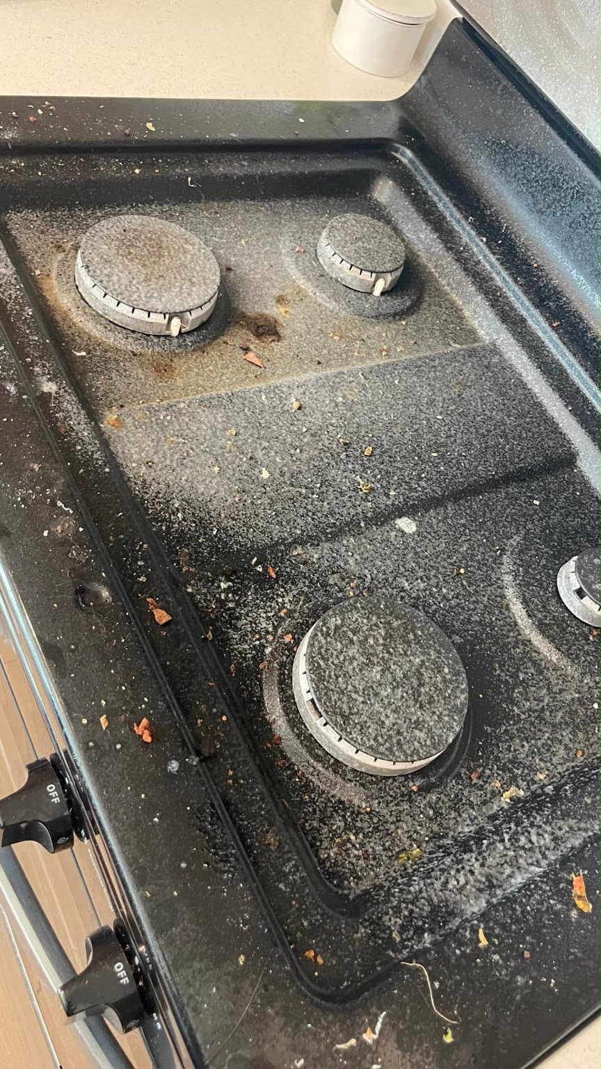 Black stovetop before cleaning
