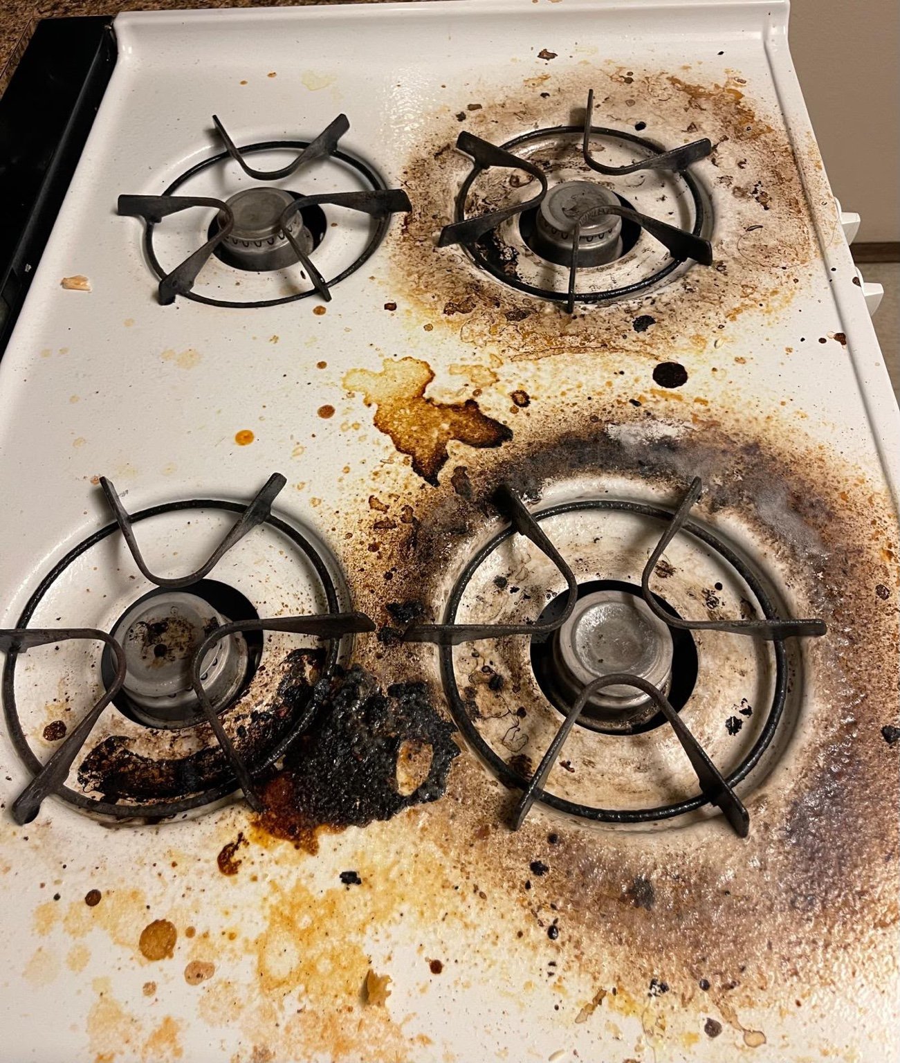 White stovetop before cleaning